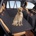 Dog sitting on the Pawdriva hard-bottom back seat extender installed in a vehicle